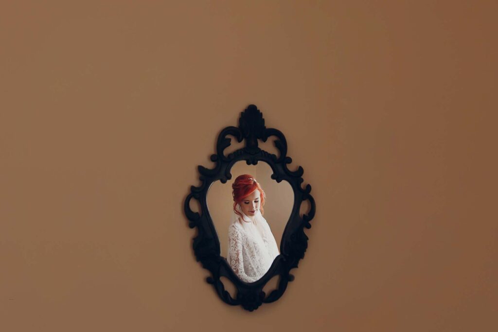 stylish-happy-bride-hand-on-luxury-wedding-dress-H8QJERP.jpg